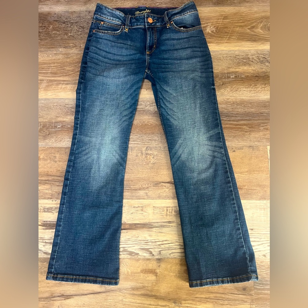 Medium to deep blue wrangler jeans size 7/30